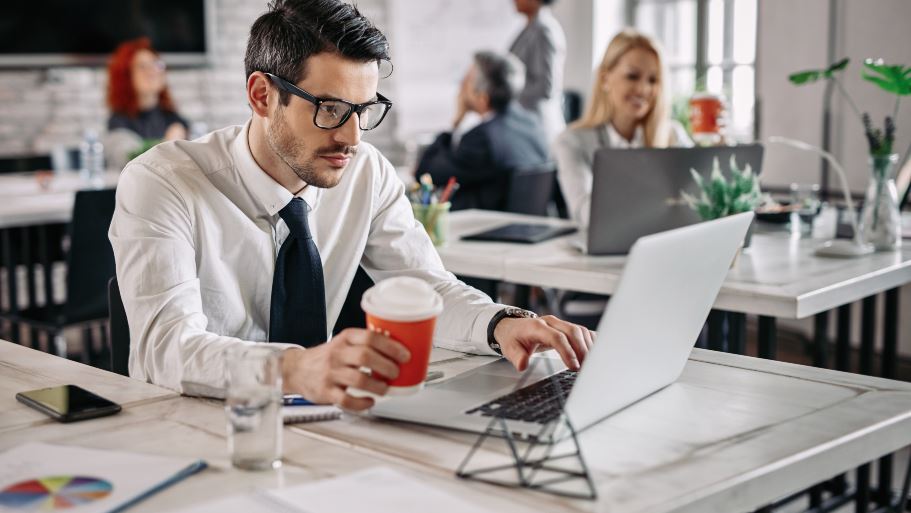 <a href="https://www.freepik.com/free-photo/young-businessman-sitting-office-working-laptop-while-drinking-coffee-there-are-people-background_25482001.htm#query=office%20working&position=1&from_view=search&track=ais&uuid=5615b5e9-206d-44ce-8312-34b6c734b371">Image by Drazen Zigic</a> on Freepik